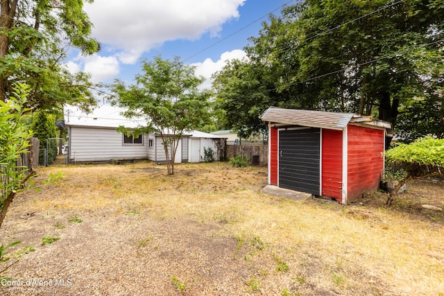 421 W Walnut Ave, Coeur Dalene, ID 83814 - fenced backyard with a storage unit
