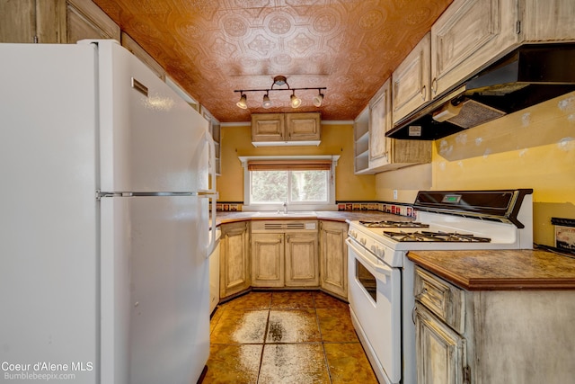 421 W Walnut Ave, Coeur Dalene, ID 83814 - kitchen with white appliances, under cabinet range hood, an ornate ceiling, and light tile patterned floors