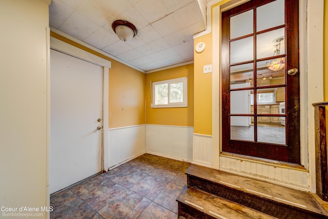 421 W Walnut Ave, Coeur Dalene, ID 83814 - entryway with a wainscoted wall and crown molding