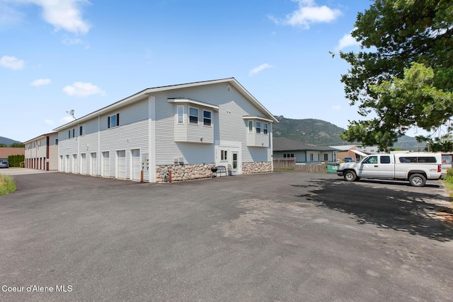1313 N Division Ave Unit C, Sandpoint, ID 83864 - view of property with a mountain view and community garages