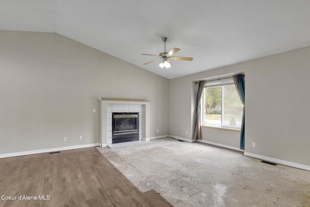 7575 W Crenshaw St, Rathdrum, ID 83858 - unfurnished living room featuring ceiling fan, a tile fireplace, and high vaulted ceiling
