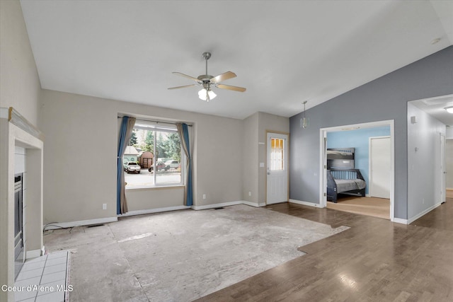 7575 W Crenshaw St, Rathdrum, ID 83858 - unfurnished living room featuring ceiling fan and vaulted ceiling