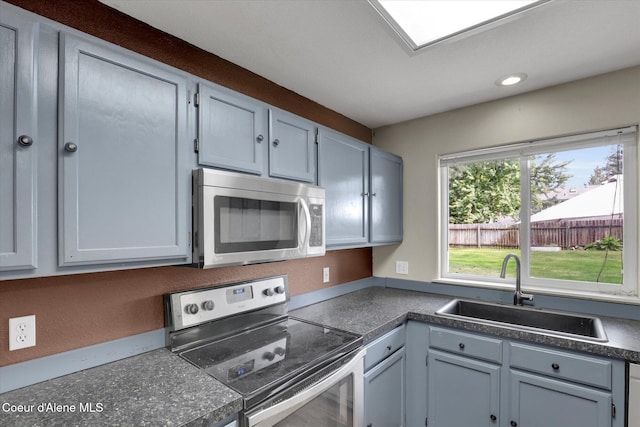 7575 W Crenshaw St, Rathdrum, ID 83858 - kitchen featuring stainless steel appliances, dark countertops, and recessed lighting