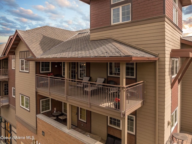 2050 N Main St, Coeur Dalene, ID 83814 - rear view of house with roof with shingles and a balcony