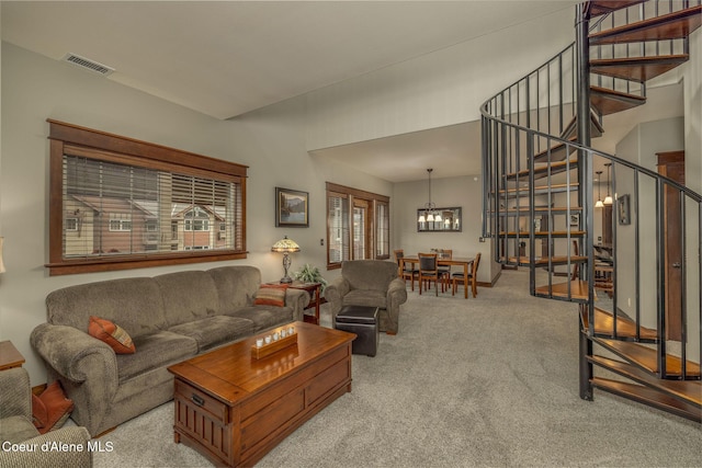 2050 N Main St, Coeur Dalene, ID 83814 - living room with stairway, carpet floors, and a chandelier