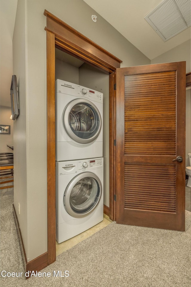 2050 N Main St, Coeur Dalene, ID 83814 - laundry room with stacked washer / drying machine and carpet flooring