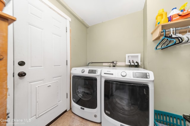1025 N 1st St, Coeur Dalene, ID 83814 - laundry room featuring washer and clothes dryer and light tile patterned flooring