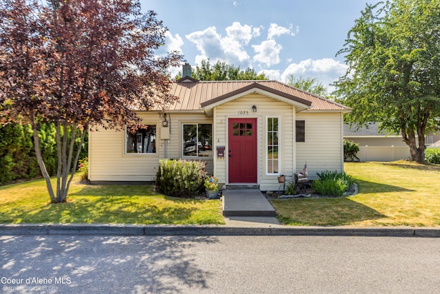 1025 N 1st St, Coeur Dalene, ID 83814 - view of front of property featuring a metal roof and a chimney
