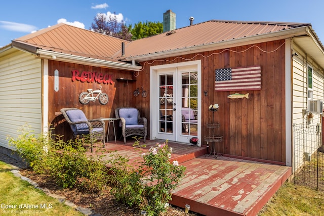 1025 N 1st St, Coeur Dalene, ID 83814 - rear view of property featuring french doors, a deck, a metal roof, and cooling unit