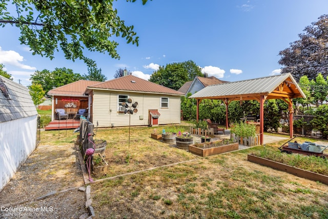 1025 N 1st St, Coeur Dalene, ID 83814 - view of yard featuring a gazebo and a vegetable garden