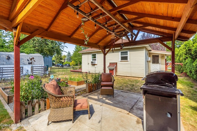 1025 N 1st St, Coeur Dalene, ID 83814 - view of patio featuring a gazebo, grilling area, and a vegetable garden