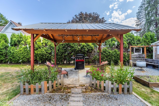 1025 N 1st St, Coeur Dalene, ID 83814 - view of patio with a gazebo, a garden, and grilling area