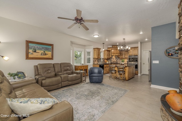 12608 N Shamrock St, Hayden, ID 83835 - living area with ceiling fan, a chandelier, recessed lighting, a textured ceiling, and light tile patterned floors
