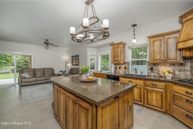 12608 N Shamrock St, Hayden, ID 83835 - kitchen with tasteful backsplash, brown cabinets, a chandelier, and a textured ceiling