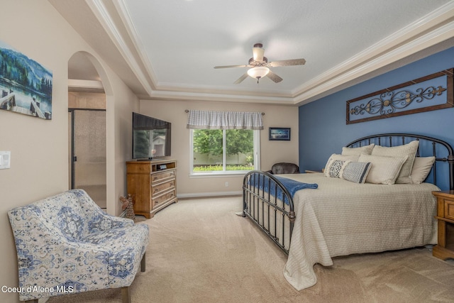 12608 N Shamrock St, Hayden, ID 83835 - bedroom with carpet flooring, crown molding, arched walkways, and a ceiling fan