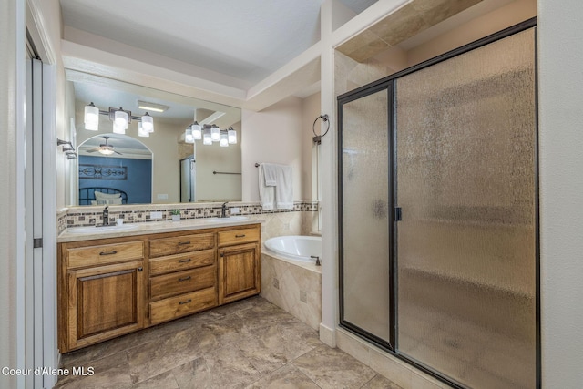 12608 N Shamrock St, Hayden, ID 83835 - full bathroom featuring a garden tub, a shower stall, and double vanity
