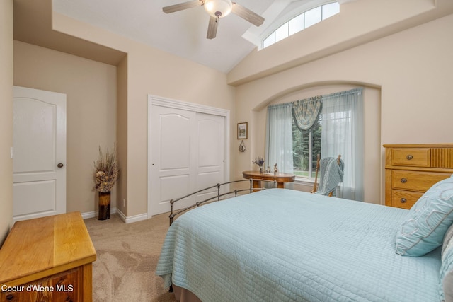 12608 N Shamrock St, Hayden, ID 83835 - bedroom featuring light colored carpet, multiple windows, lofted ceiling, a closet, and ceiling fan
