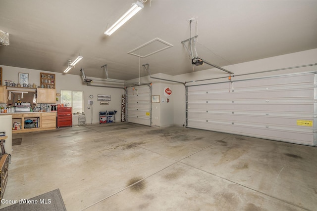 12608 N Shamrock St, Hayden, ID 83835 - garage featuring a garage door opener