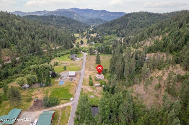 1875 S Gateway Ranch Rd, Coeur Dalene, ID 83814 - view of property location featuring a mountainous background and a forest