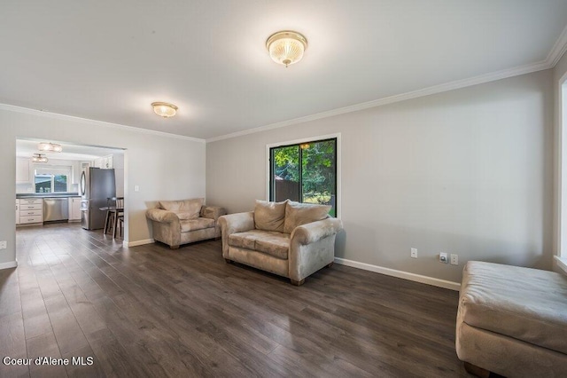 916 E Hanley Ave, Dalton Gardens, ID 83815 - living room featuring crown molding, dark wood-style flooring, and plenty of natural light