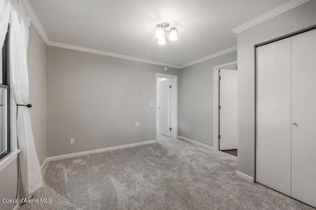916 E Hanley Ave, Dalton Gardens, ID 83815 - unfurnished bedroom featuring carpet floors, crown molding, and a closet