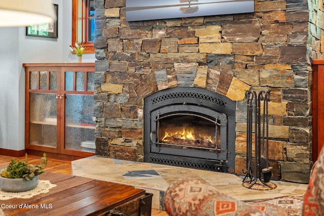 4127 Sagle Rd, Sagle, ID 83860 - detailed view of a lit fireplace and wood finished floors