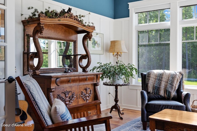 4127 Sagle Rd, Sagle, ID 83860 - living area featuring a decorative wall, wood finished floors, and wainscoting