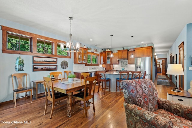 4127 Sagle Rd, Sagle, ID 83860 - dining area featuring hardwood / wood-style floors, a chandelier, and recessed lighting