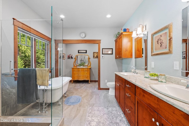 4127 Sagle Rd, Sagle, ID 83860 - full bath featuring a freestanding bath, double vanity, marble look tile flooring, and recessed lighting