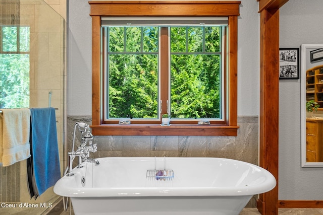 4127 Sagle Rd, Sagle, ID 83860 - full bath featuring a freestanding tub, plenty of natural light, and a textured wall