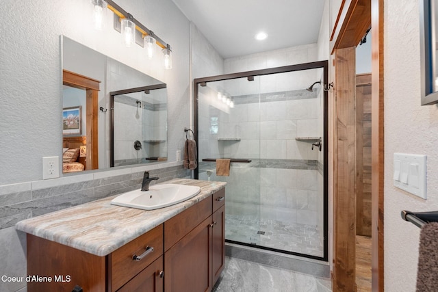 4127 Sagle Rd, Sagle, ID 83860 - bathroom featuring vanity, a stall shower, and a textured wall