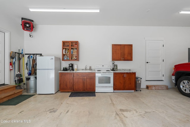 4127 Sagle Rd, Sagle, ID 83860 - kitchen featuring white appliances, brown cabinets, and light countertops