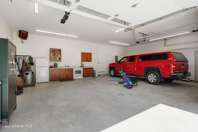 4127 Sagle Rd, Sagle, ID 83860 - garage with freestanding refrigerator and washer / clothes dryer