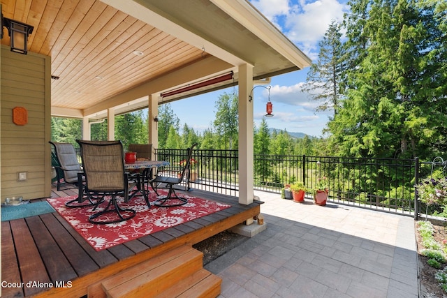 4127 Sagle Rd, Sagle, ID 83860 - view of patio featuring outdoor dining space and a wooden deck