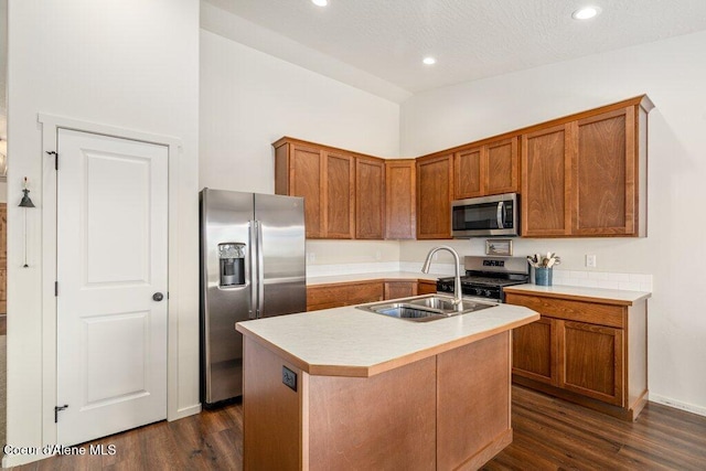 10514 N Liverpool Loop, Hayden, ID 83835 - kitchen with appliances with stainless steel finishes, brown cabinets, dark wood finished floors, and recessed lighting