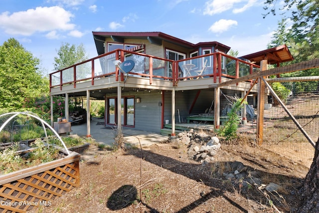 5143 W Crazy Creek Rd, Coeur Dalene, ID 83814 - rear view of property with a wooden deck