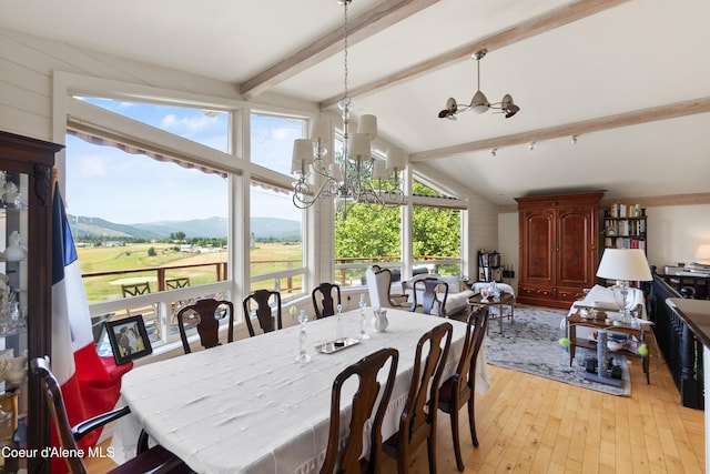 5143 W Crazy Creek Rd, Coeur Dalene, ID 83814 - dining area with a chandelier, light wood-type flooring, and a mountain view