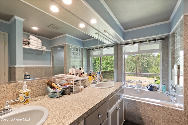 5143 W Crazy Creek Rd, Coeur Dalene, ID 83814 - bathroom with plenty of natural light, double vanity, crown molding, a garden tub, and recessed lighting