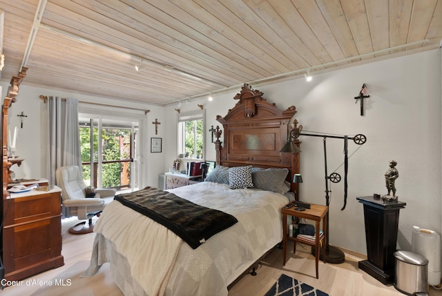 5143 W Crazy Creek Rd, Coeur Dalene, ID 83814 - bedroom featuring track lighting, wood finished floors, and wood ceiling