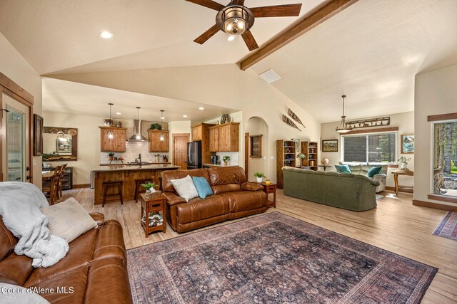 21315 N Eclipse Rd, Rathdrum, ID 83858 - living area with light wood finished floors, ceiling fan, arched walkways, and recessed lighting
