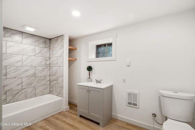 110 Cedar St, Priest River, ID 83856 - bathroom with vanity, wood finished floors, heating unit, bathtub / shower combination, and recessed lighting