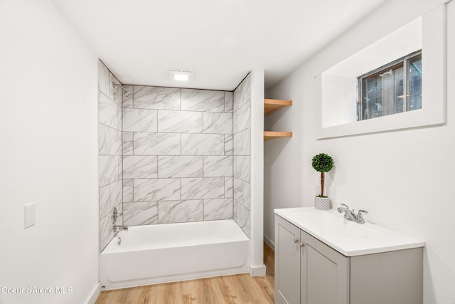110 Cedar St, Priest River, ID 83856 - full bathroom with wood finished floors, vanity, and bathing tub / shower combination