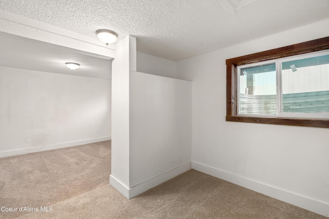 110 Cedar St, Priest River, ID 83856 - carpeted spare room featuring baseboards and a textured ceiling