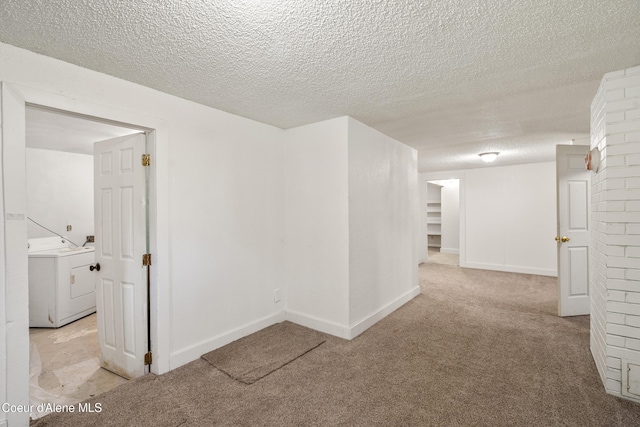 110 Cedar St, Priest River, ID 83856 - hall featuring washer / clothes dryer, a textured ceiling, and carpet floors