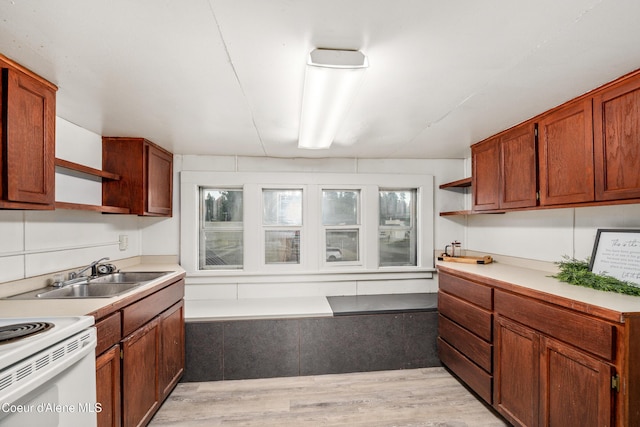 110 Cedar St, Priest River, ID 83856 - kitchen featuring open shelves, light countertops, light wood-style floors, and white electric stove