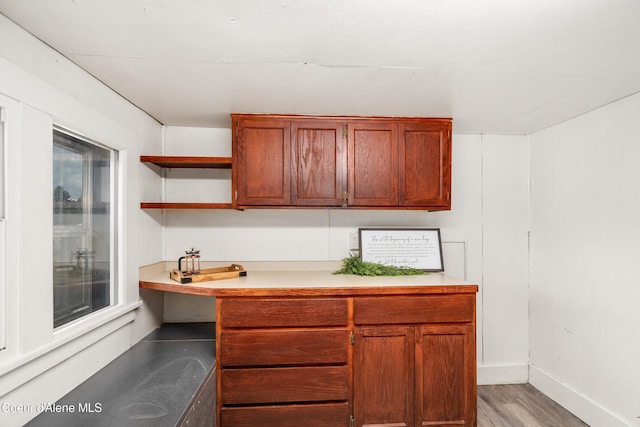110 Cedar St, Priest River, ID 83856 - kitchen with light countertops, light wood-type flooring, and open shelves