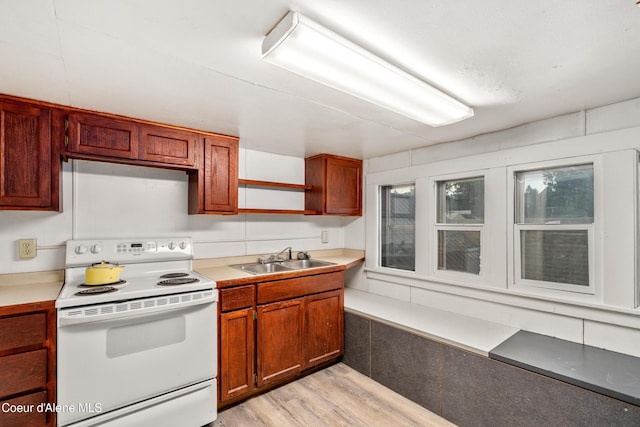 110 Cedar St, Priest River, ID 83856 - kitchen with electric range, light wood finished floors, and light countertops