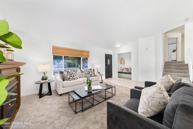 870 E Cloverleaf Dr, Hayden, ID 83835 - carpeted living room featuring stairs and lofted ceiling