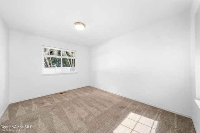870 E Cloverleaf Dr, Hayden, ID 83835 - carpeted empty room featuring baseboards