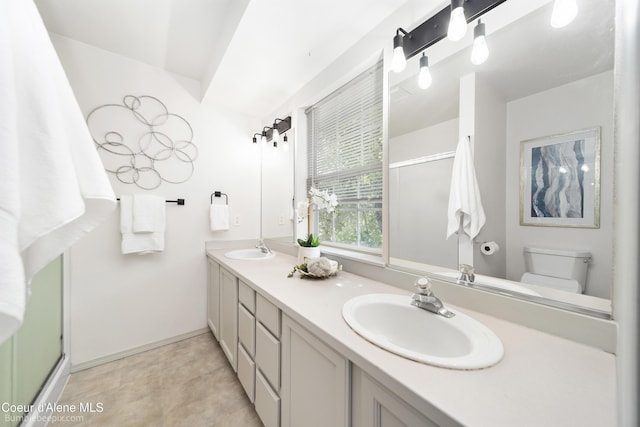 870 E Cloverleaf Dr, Hayden, ID 83835 - bathroom with double vanity and a shower with door